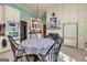 Eat-in kitchen featuring tile flooring, white cabinets, and stainless steel appliances at 86 Victoria Dr, Moreland, GA 30259