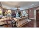 Cozy living room with hardwood floors, large windows, and comfortable seating at 86 Victoria Dr, Moreland, GA 30259