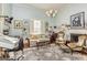 Comfortable living room featuring hardwood floors, fireplace, and unique lighting fixture at 86 Victoria Dr, Moreland, GA 30259