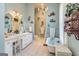 Bright main bathroom with a vanity, tub, and decorative wall hangings at 86 Victoria Dr, Moreland, GA 30259