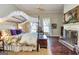 Spacious main bedroom with a four-poster bed, fireplace, and hardwood floors at 86 Victoria Dr, Moreland, GA 30259