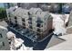 Aerial view of multi-story townhomes with balconies and on street parking at 6422 Paulson, Atlanta, GA 30328