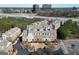 An aerial view of townhomes with multiple buildings, parking, and landscaping near a highway at 6422 Paulson, Atlanta, GA 30328