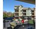 View from the balcony with black iron railing and seating looking out to the condo community at 6422 Paulson, Atlanta, GA 30328