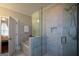 This bathroom features a walk-in shower, soaking tub, and neutral tile at 6422 Paulson, Atlanta, GA 30328