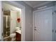 View of bathroom and garage access door with heart-shaped decoration on the wall at 6422 Paulson, Atlanta, GA 30328