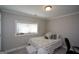Bedroom with a twin bed, gray walls, white trim, a window and an accent pillow at 6422 Paulson, Atlanta, GA 30328
