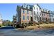 Beautiful townhome with brick exterior, dormer windows, and meticulously landscaped grounds at 6422 Paulson, Atlanta, GA 30328