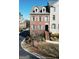 Beautiful townhome with brick exterior, dormer windows, and meticulously landscaped grounds at 6422 Paulson, Atlanta, GA 30328