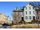 Attractive townhome showcasing brick facade, dormer windows, and well-maintained landscaping at 6422 Paulson, Atlanta, GA 30328