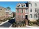 Charming townhome featuring a brick facade, dormer windows, and inviting entry stairs at 6422 Paulson, Atlanta, GA 30328