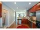 Well-lit kitchen featuring granite countertops, stainless steel appliances, and a view to the living room at 6422 Paulson, Atlanta, GA 30328