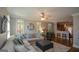 Inviting living room with a comfortable sectional sofa, ceiling fan and view to kitchen at 6422 Paulson, Atlanta, GA 30328