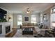 Comfortable living room featuring hardwood floors, a fireplace, and a plush sectional sofa at 6422 Paulson, Atlanta, GA 30328