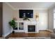 Bright living room featuring a fireplace with built-ins and a large screen television at 6422 Paulson, Atlanta, GA 30328