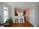 Open-concept living space that flows into the kitchen area, featuring bar seating and an open design at 6422 Paulson, Atlanta, GA 30328