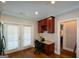 A small office area adjoins the kitchen, featuring built-in storage, a desk, and lots of natural light at 6422 Paulson, Atlanta, GA 30328