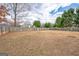 Expansive backyard surrounded by a tall wooden privacy fence at 700 Brand South Trl, Lawrenceville, GA 30046