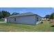 View of the backyard of a newly constructed home featuring a lush sodded lawn at 8591 Seabiscuit Rd # 113, Lithonia, GA 30058