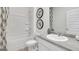 Bathroom with a shower-tub combo, contemporary fixtures, and stylish decor at 8591 Seabiscuit Rd # 113, Lithonia, GA 30058