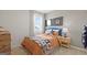 Bright bedroom featuring sports themed bedding, complemented by wood furnishings and natural light at 8591 Seabiscuit Rd # 113, Lithonia, GA 30058