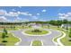 Street view of the community roundabout with newly constructed homes and well-manicured lawns at 8591 Seabiscuit Rd # 113, Lithonia, GA 30058