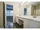 Bright bathroom with dual sinks and vanity, seamlessly connecting to the bedroom at 5827 Highgrove Dr, Atlanta, GA 30349