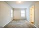 Neutral bedroom featuring plush carpet, plenty of natural light, and fresh paint at 5827 Highgrove Dr, Atlanta, GA 30349
