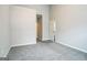 This bedroom is carpeted and has two entry doors and neutral walls at 5827 Highgrove Dr, Atlanta, GA 30349