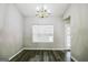 Bright dining room with hardwood floors and a traditional chandelier at 5827 Highgrove Dr, Atlanta, GA 30349