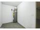 A utility room with a water heater and light-colored flooring at 5827 Highgrove Dr, Atlanta, GA 30349