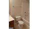 Well-maintained bathroom with tiled shower, ceramic toilet, and vanity with wooden cabinets at 2941 Vining Ridge Ter, Decatur, GA 30034