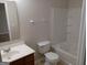 Clean bathroom featuring a combination shower and tub, ceramic toilet, and modern vanity sink at 2941 Vining Ridge Ter, Decatur, GA 30034