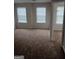 Spacious bedroom featuring neutral walls, plush carpeting, and large windows offering natural light at 2941 Vining Ridge Ter, Decatur, GA 30034