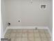Functional laundry room with tile flooring, utility connections, and ample space for appliances at 2941 Vining Ridge Ter, Decatur, GA 30034