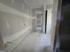 Unfinished bathroom features drywall, fixtures, and doorways ready for finishing touches at Lot C Montannas Way, Moreland, GA 30259