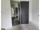 Bathroom doorway featuring a view to a double marble vanity and tiled shower at Lot C Montannas Way, Moreland, GA 30259