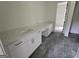 Bathroom featuring a double vanity with marble countertop and gold hardware at Lot C Montannas Way, Moreland, GA 30259
