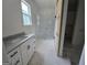 Elegant bathroom boasts white marble, modern vanity and fixtures, and frameless glass shower at Lot C Montannas Way, Moreland, GA 30259
