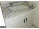 Bathroom vanity with marble countertop, storage, and undermount sink at Lot C Montannas Way, Moreland, GA 30259
