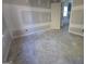 Unfinished bedroom featuring drywall and trim work, with a door and window at Lot C Montannas Way, Moreland, GA 30259