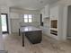 Spacious kitchen with white cabinets, a large island, and stainless appliances at Lot C Montannas Way, Moreland, GA 30259