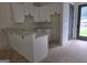 Kitchenette featuring white cabinets and stone-style countertops at Lot C Montannas Way, Moreland, GA 30259
