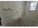 Laundry room featuring shaker cabinets and a window at Lot C Montannas Way, Moreland, GA 30259
