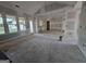 Spacious unfinished living room featuring large windows, drywall and fixtures at Lot C Montannas Way, Moreland, GA 30259