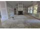 Unfinished living room featuring a fireplace, high ceiling and large windows at Lot C Montannas Way, Moreland, GA 30259