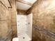 Bathroom with a stand-up shower, a tiled wall, and a towel rack at 2634 Rockcliff Se Rd, Atlanta, GA 30316