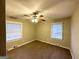 Inviting bedroom with neutral walls, plush carpet, ceiling fan and ample natural light from a large window at 2634 Rockcliff Se Rd, Atlanta, GA 30316