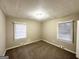 Bright bedroom with neutral walls, plush carpet, and ample natural light from a large window at 2634 Rockcliff Se Rd, Atlanta, GA 30316