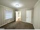 Bright bedroom with neutral carpet, fresh paint, and ample natural light from a large window at 2634 Rockcliff Se Rd, Atlanta, GA 30316